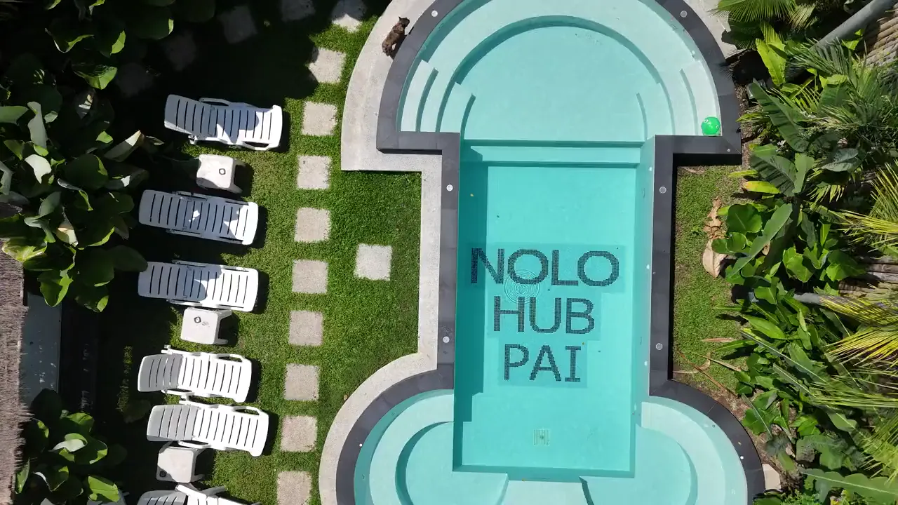 The pool from above, NOLO HUB PAI in tiles along its length