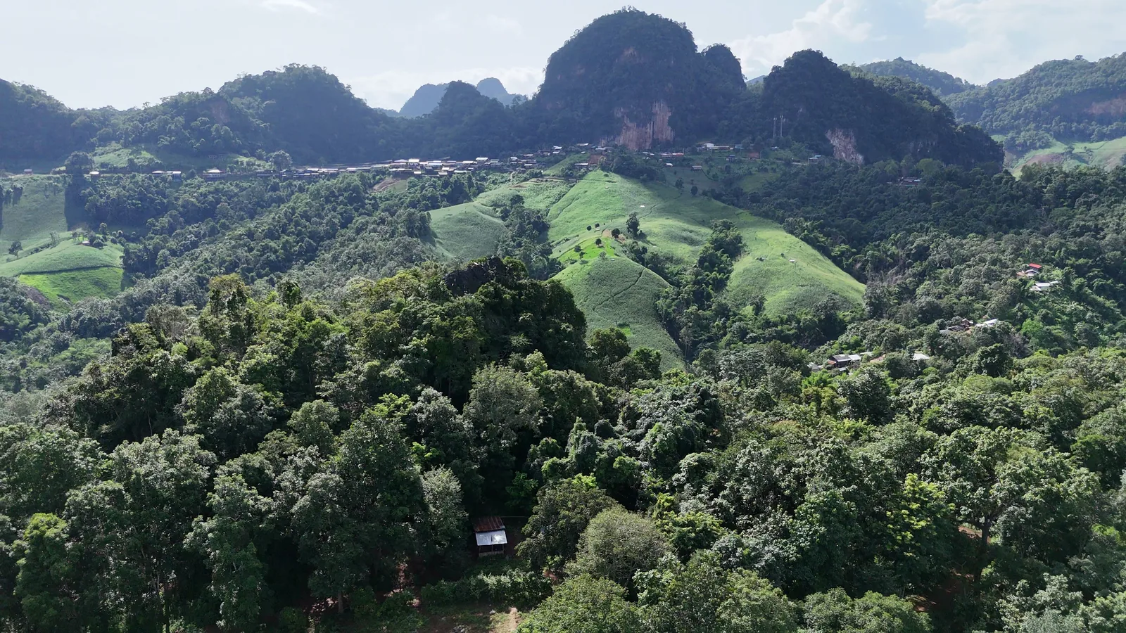 Limestone peaks and green hillsides around Ban Jabo