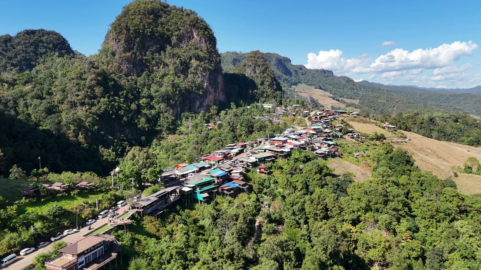 Ban Jabo’s houses along the ridge road, under a limestone peak