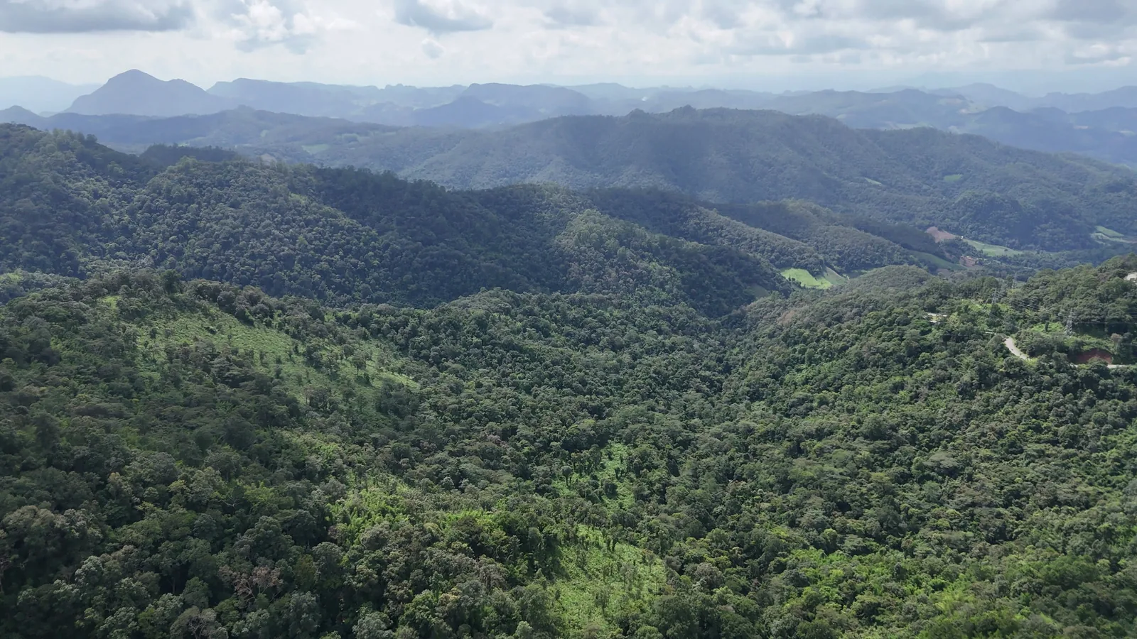 Ridge after ridge of forested mountains beyond Doi Kiew Lom