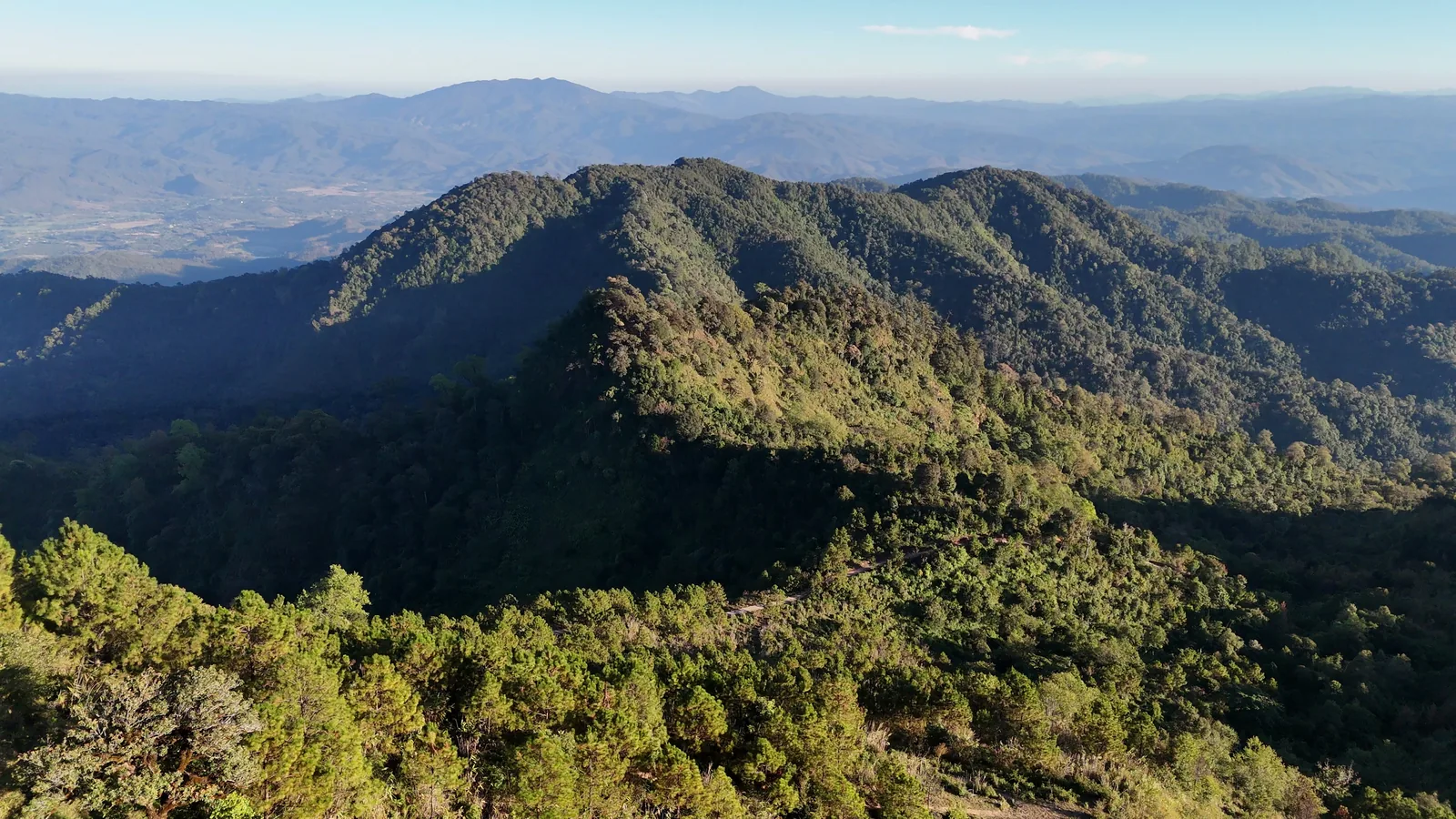Forested ridges falling away from Doi Thong towards the valley