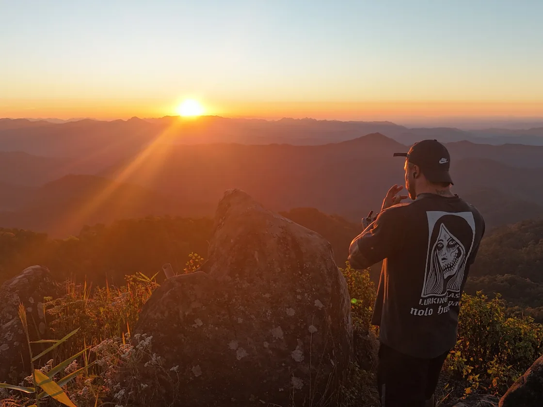 Watching the sun go down over the ridges from the rocks at the top of Doi Thong