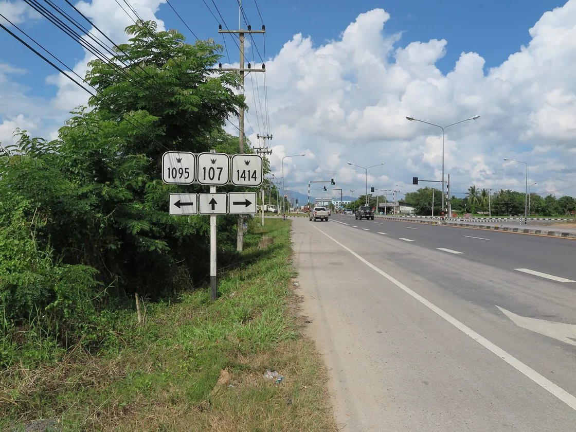 Route signs on the road from Chiang Mai: the 1095 to the left, the 107 straight on and the 1414 to the right