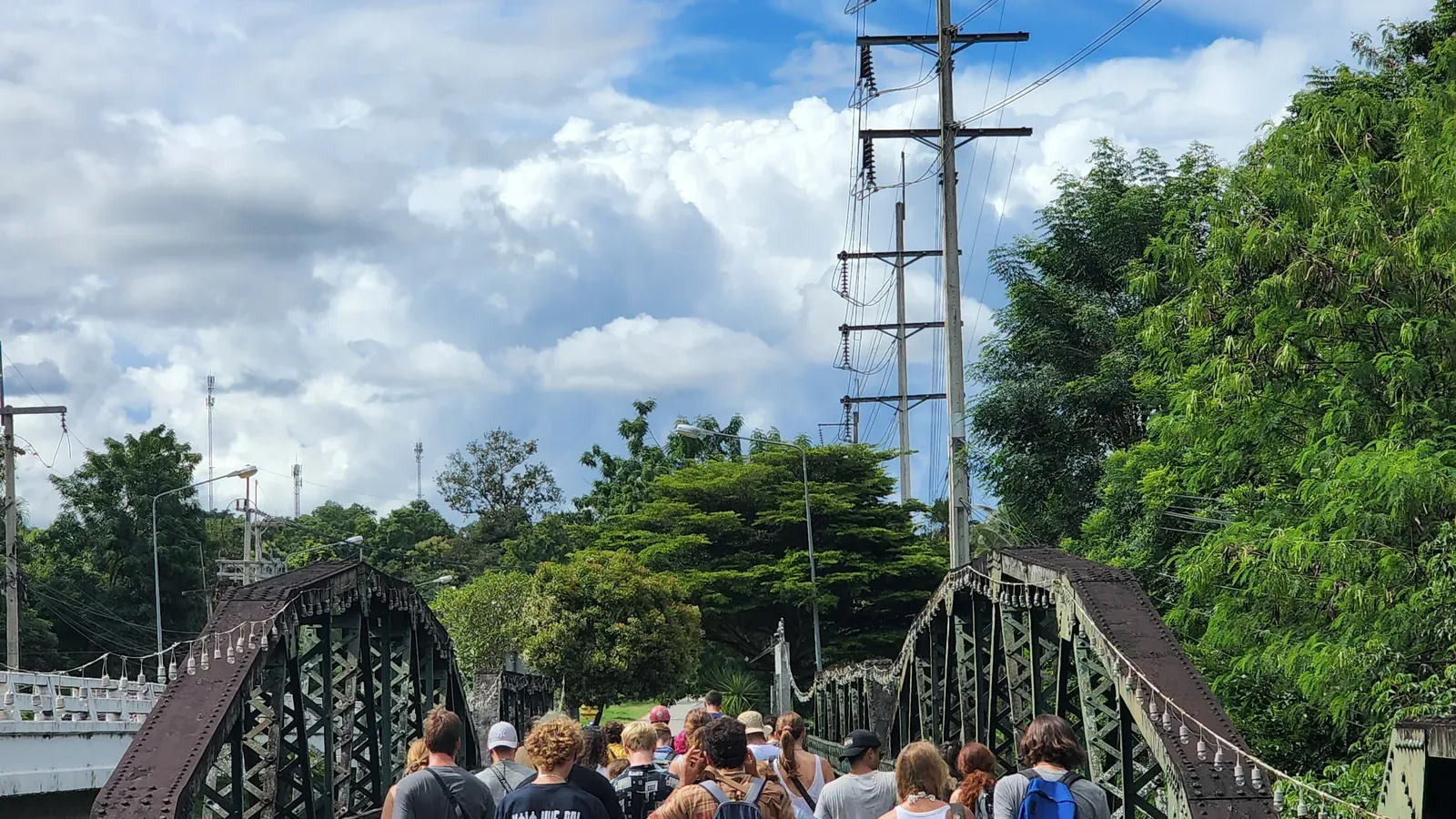 A group walking across the Memorial Bridge on a bright day