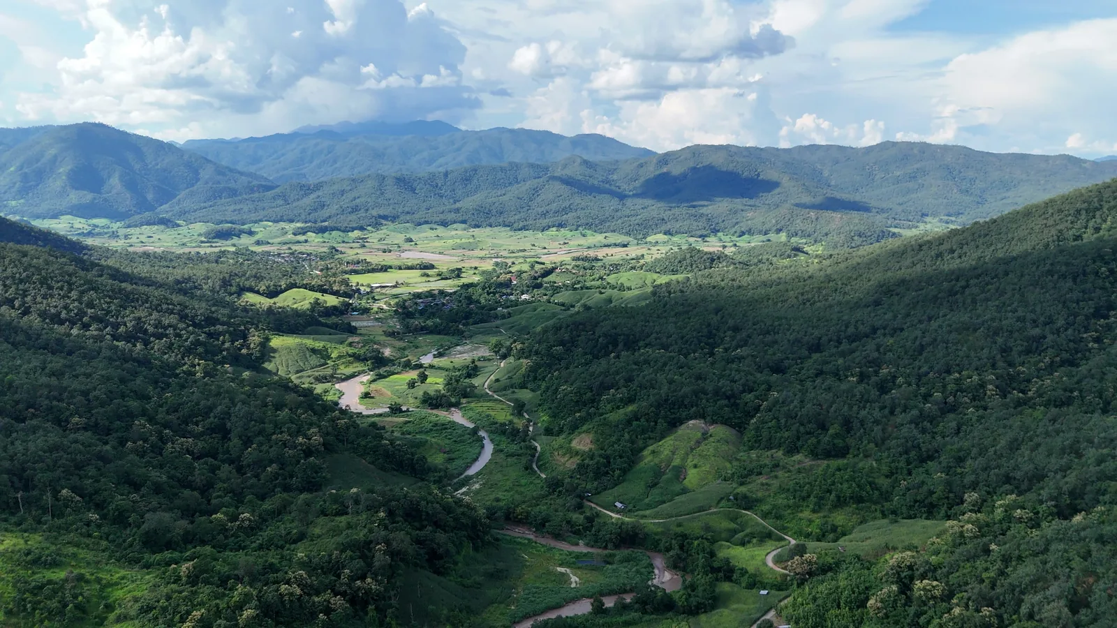 The green valley around Muang Paeng, with mountains behind