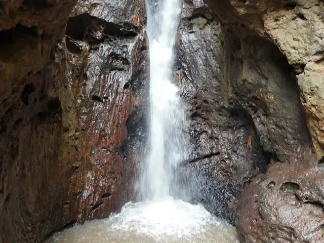 Pam Bok Waterfall dropping into its pool between the gorge walls