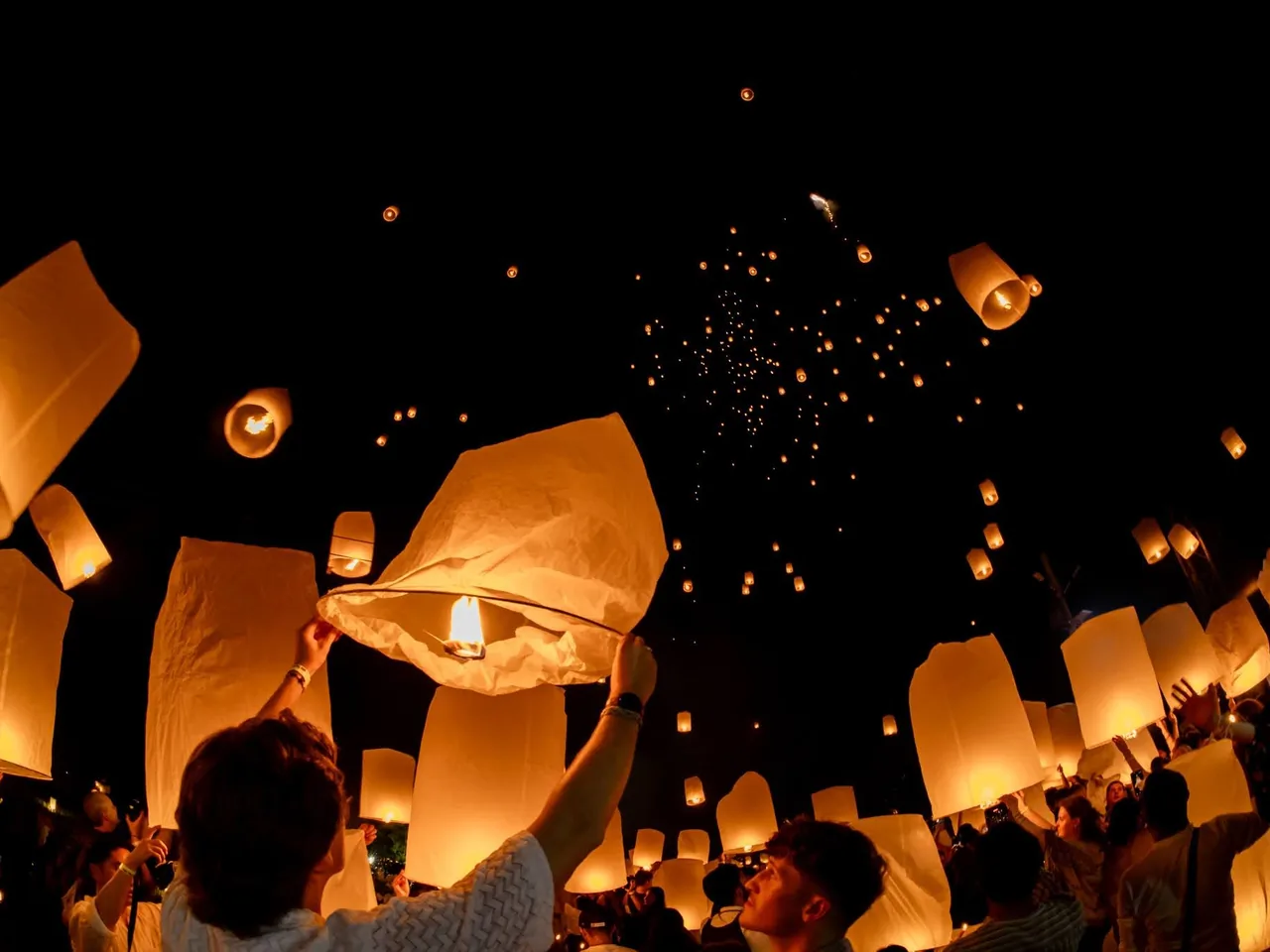 Stamps Backpackers guests releasing sky lanterns at Yi Peng in Chiang Mai