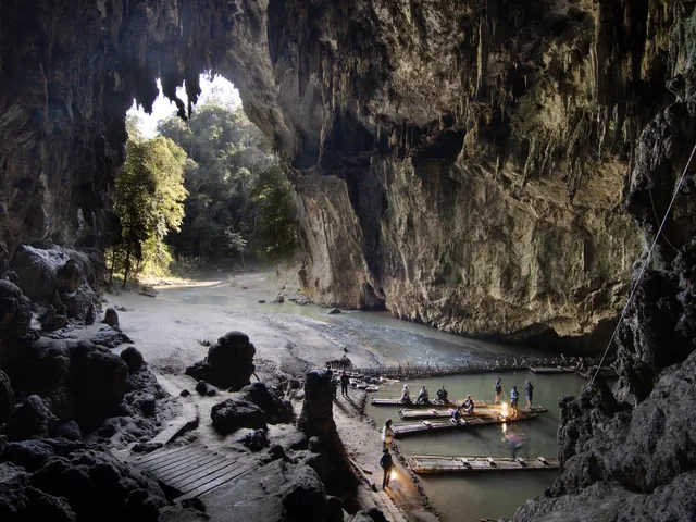 The river running through Tham Lod, with bamboo rafts
