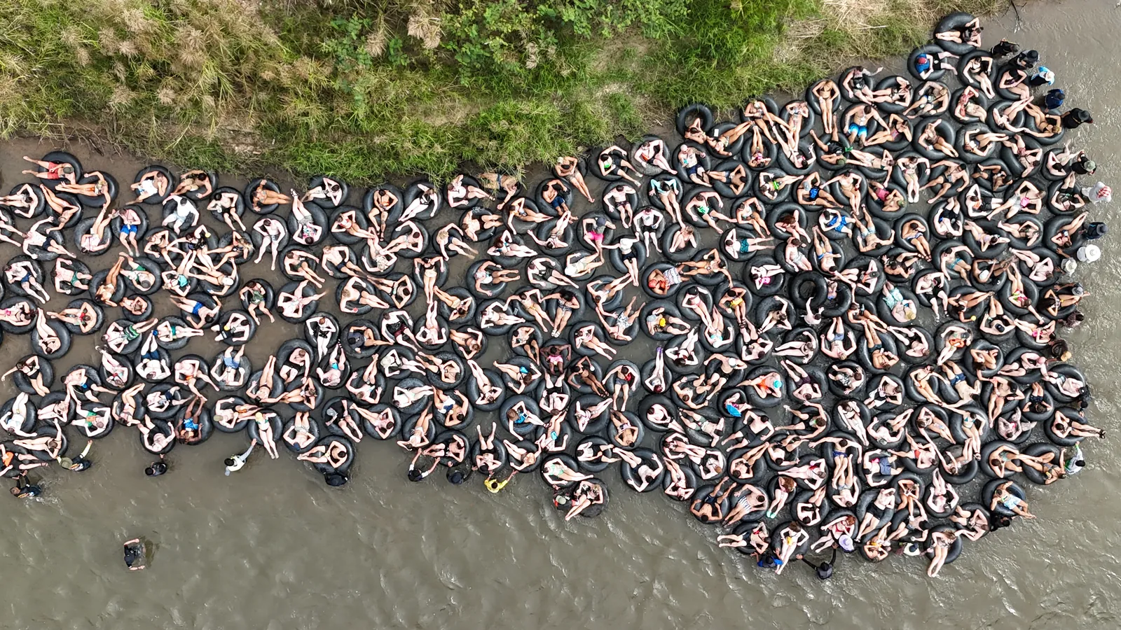 Hundreds of tubes packed together on the Pai River, seen from directly above